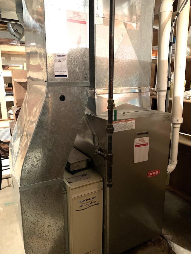 utility room with heating unit