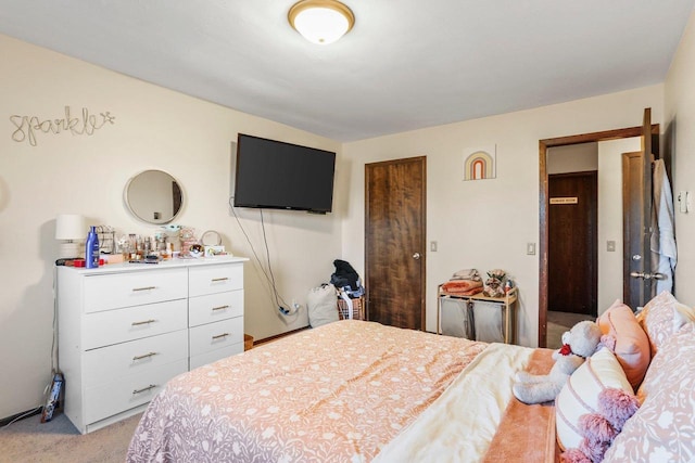 bedroom featuring light carpet