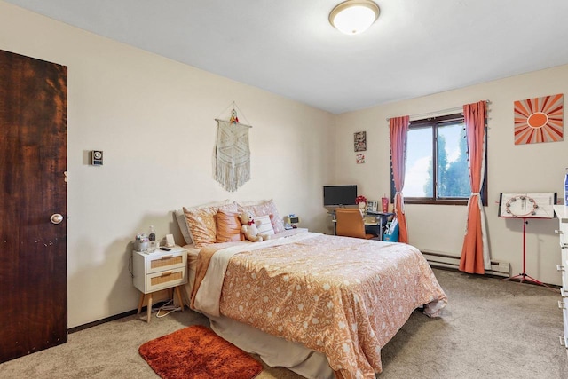 bedroom featuring light carpet and a baseboard heating unit