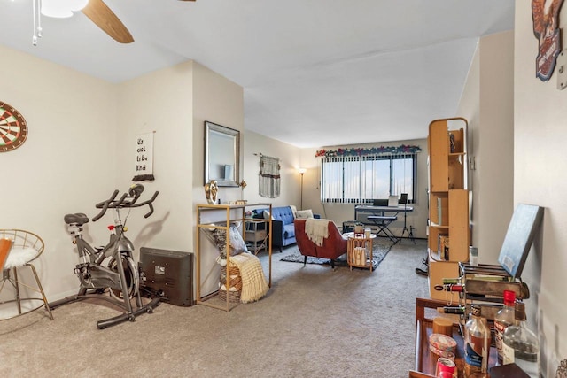 living room featuring ceiling fan and carpet flooring