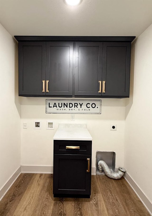 washroom with cabinets, electric dryer hookup, hardwood / wood-style flooring, and washer hookup