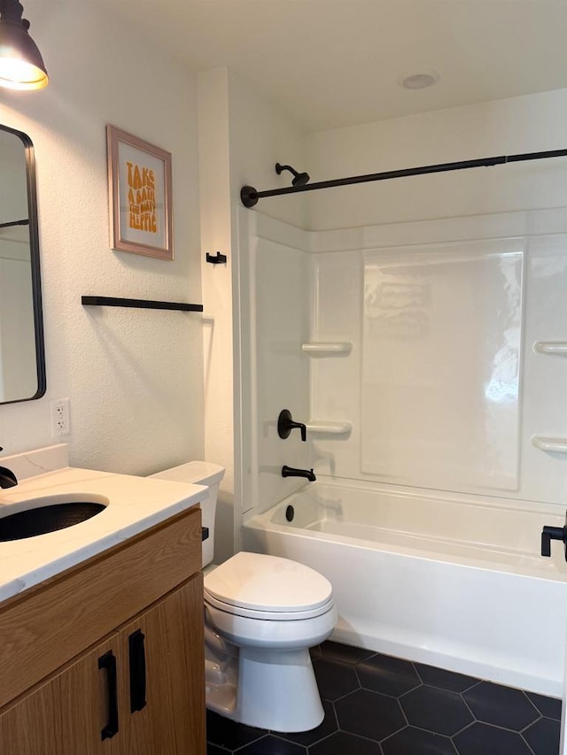 full bathroom featuring shower / bath combination, vanity, tile patterned floors, and toilet