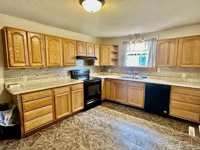 kitchen with tasteful backsplash, sink, a textured ceiling, and black appliances