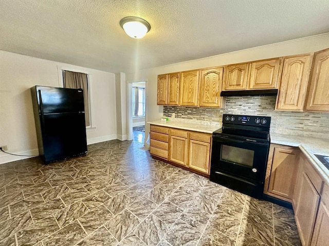 kitchen with a textured ceiling, decorative backsplash, and black appliances