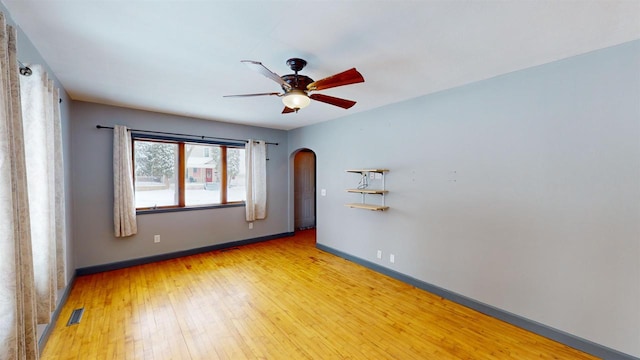 spare room with ceiling fan and light hardwood / wood-style flooring