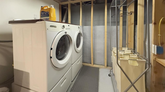 laundry room with washing machine and clothes dryer