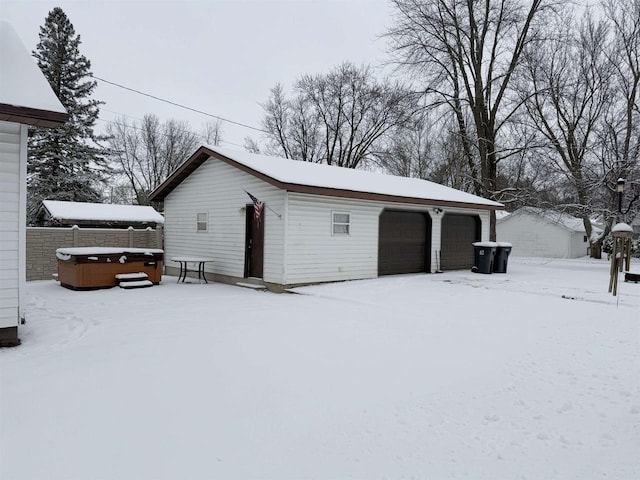 view of snow covered garage