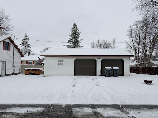 view of snow covered garage