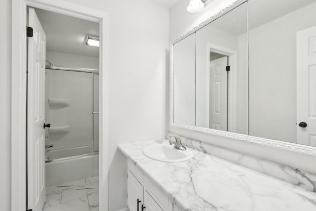 bathroom featuring vanity and shower / bath combination with glass door