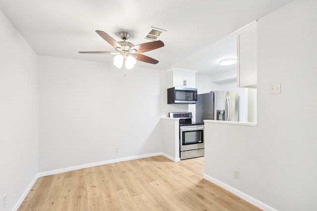 kitchen featuring ceiling fan, light hardwood / wood-style floors, white cabinets, and appliances with stainless steel finishes