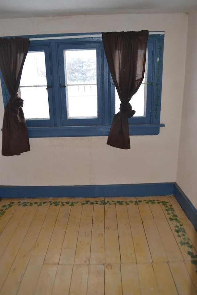 unfurnished room featuring wood-type flooring