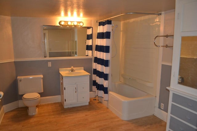 full bathroom with shower / tub combo, vanity, toilet, and hardwood / wood-style floors