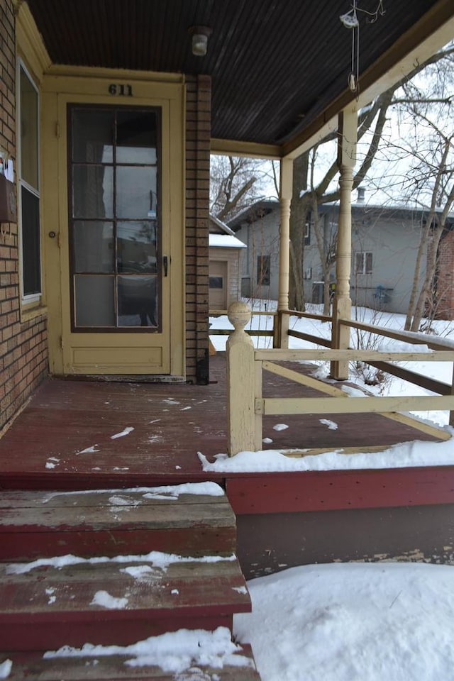 view of snow covered property entrance