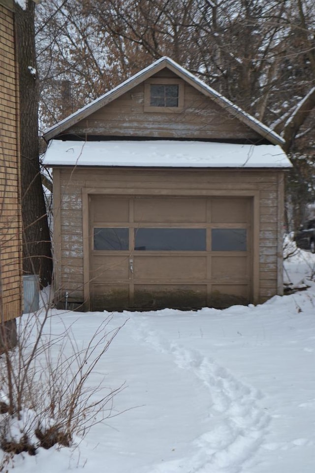 view of snow covered garage