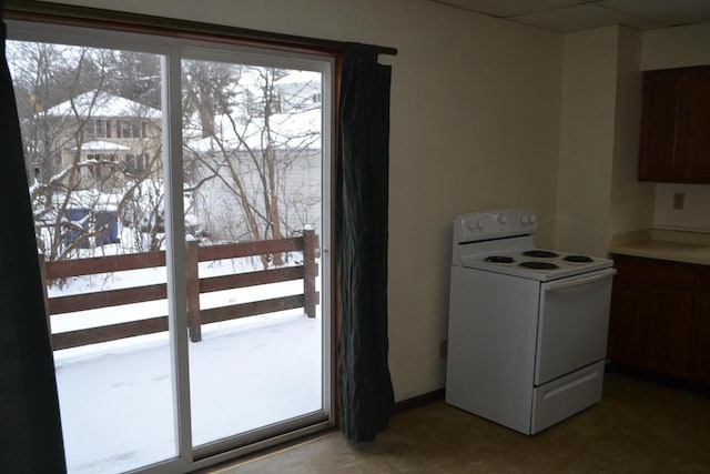 kitchen featuring a healthy amount of sunlight and white electric range oven