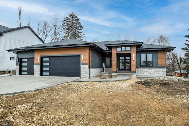 view of front of house with french doors and a garage