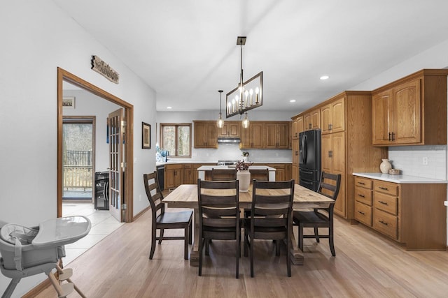 dining space with light hardwood / wood-style flooring