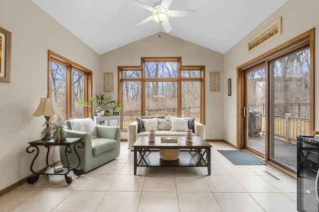 sunroom / solarium featuring vaulted ceiling, a wealth of natural light, and ceiling fan