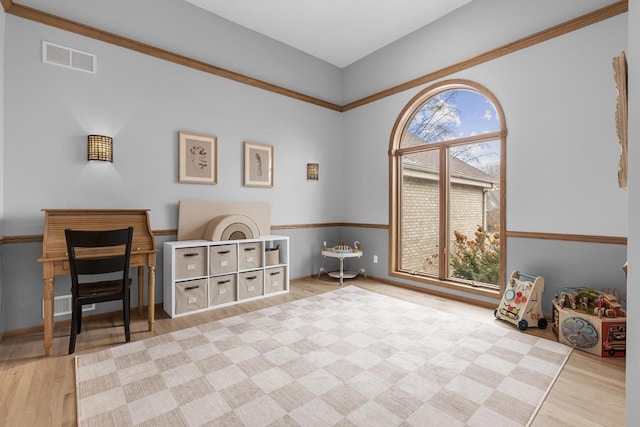 living area featuring a healthy amount of sunlight and light hardwood / wood-style floors