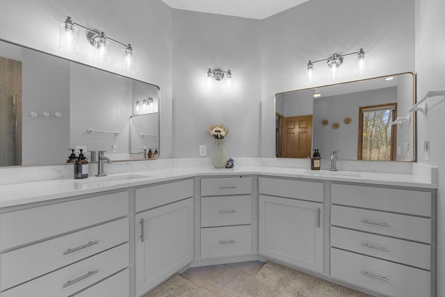 bathroom featuring tile patterned flooring and vanity