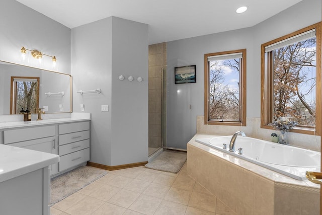 bathroom featuring vanity, plus walk in shower, and tile patterned flooring