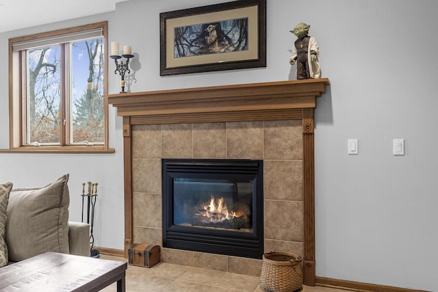 sitting room with light tile patterned flooring and a tile fireplace