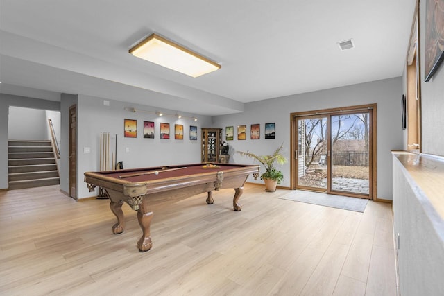 playroom with billiards and light hardwood / wood-style floors