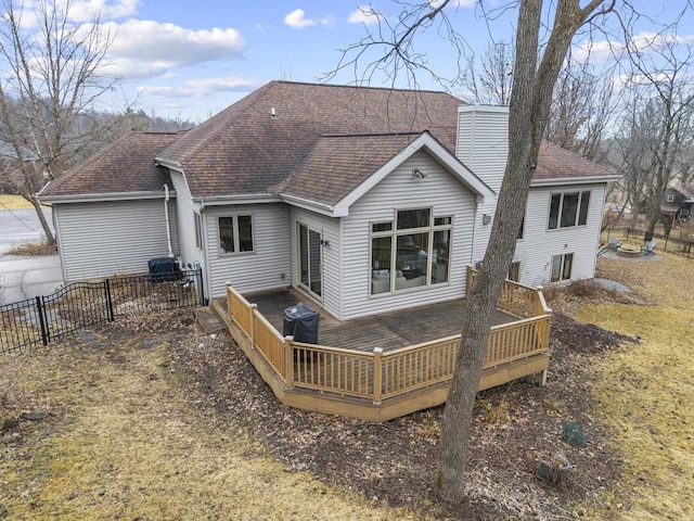 back of property featuring a wooden deck