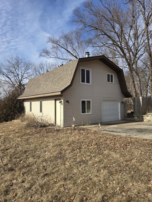 view of side of home with a garage