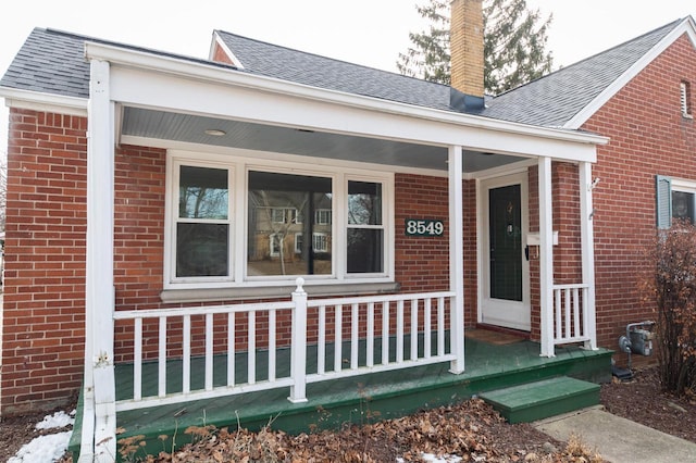 doorway to property featuring a porch