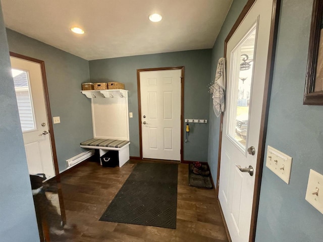 mudroom with dark hardwood / wood-style flooring and baseboard heating