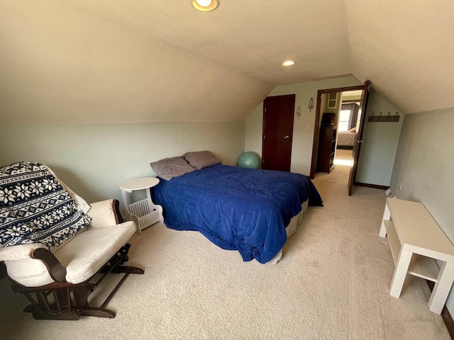 carpeted bedroom featuring vaulted ceiling