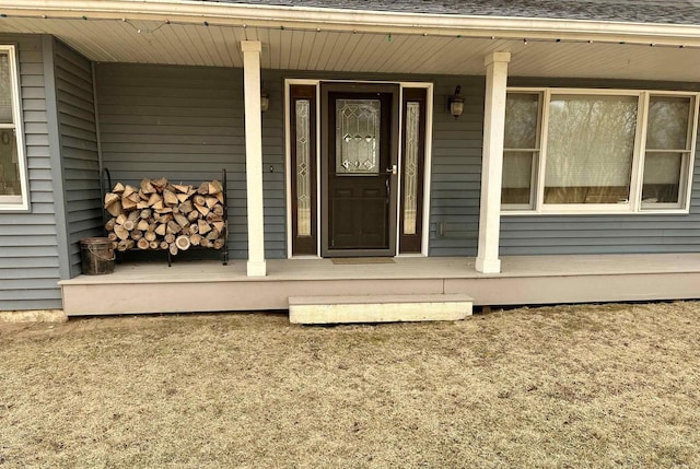 view of exterior entry with covered porch