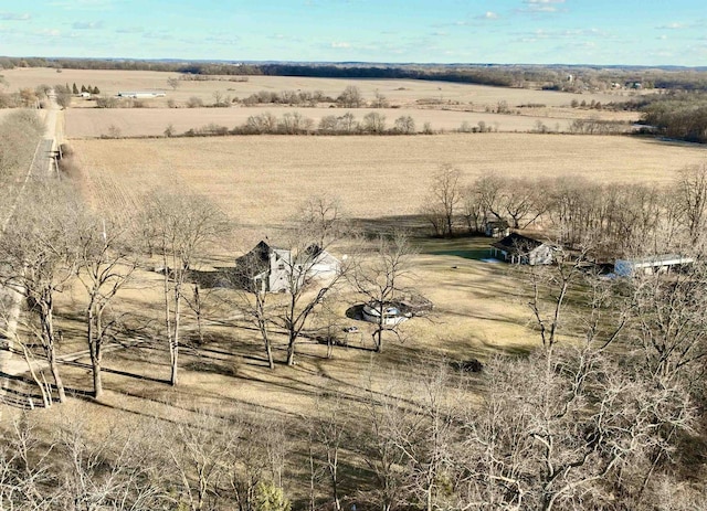 birds eye view of property with a rural view