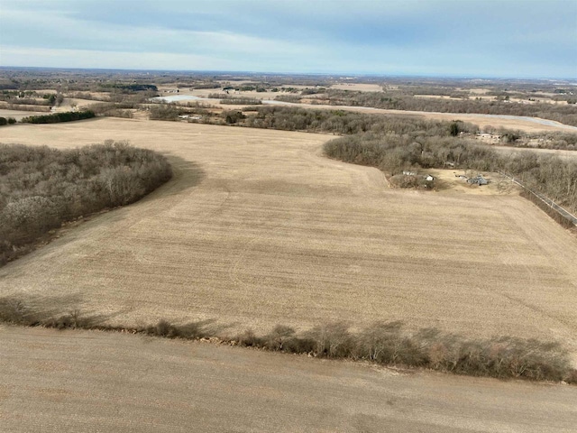 birds eye view of property featuring a rural view