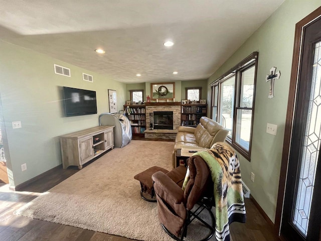 living room featuring dark hardwood / wood-style floors and a fireplace