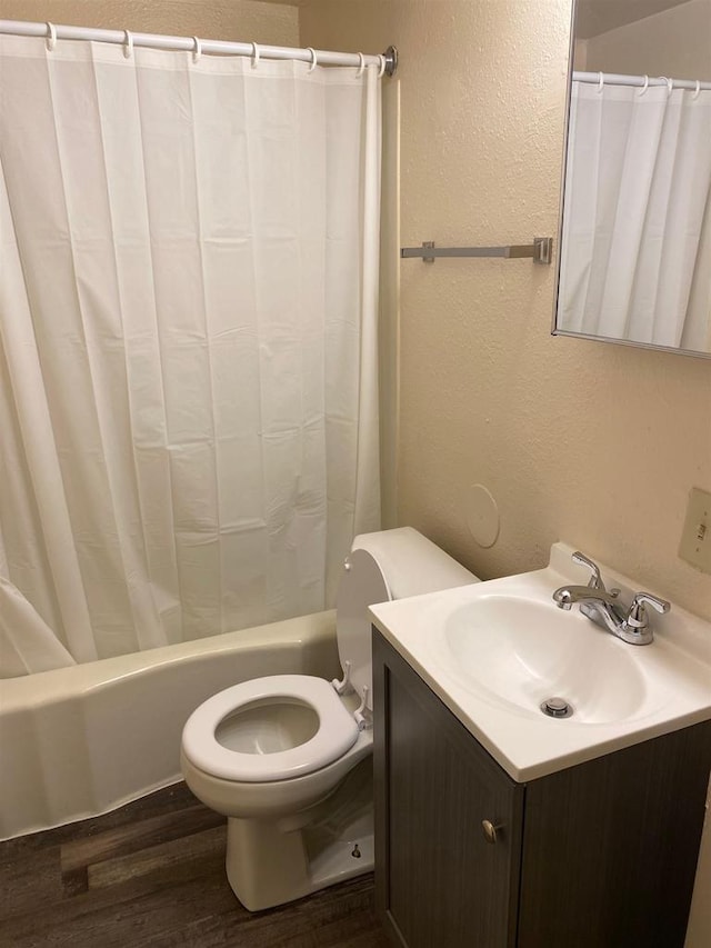 full bathroom with shower / bath combination with curtain, vanity, toilet, and hardwood / wood-style floors