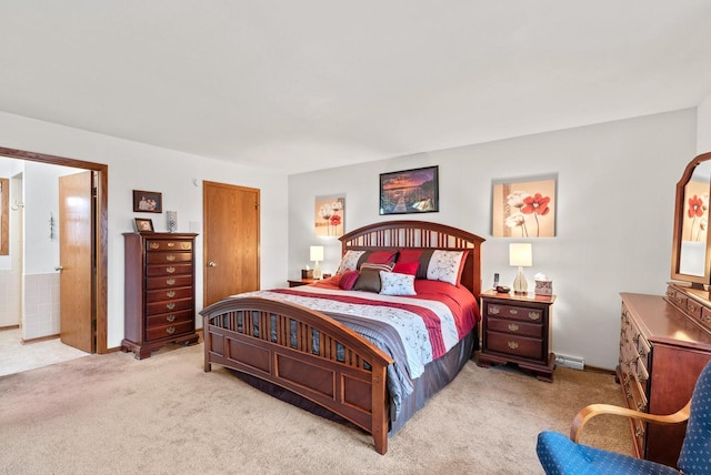 bedroom featuring light colored carpet