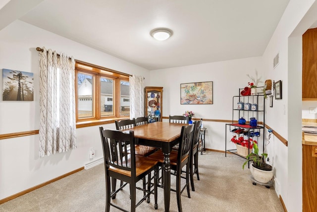 view of carpeted dining space