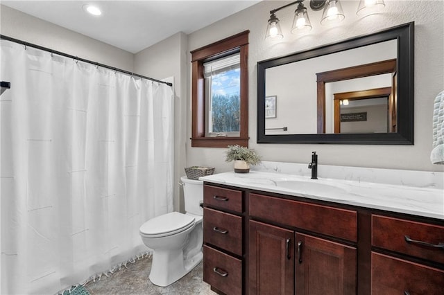 bathroom with vanity and toilet