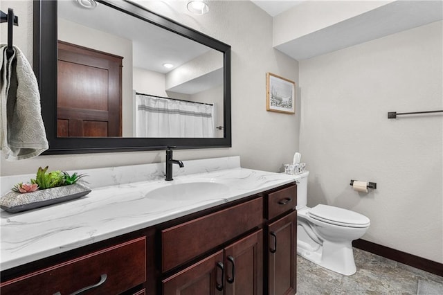 bathroom with vanity, toilet, and a shower with shower curtain