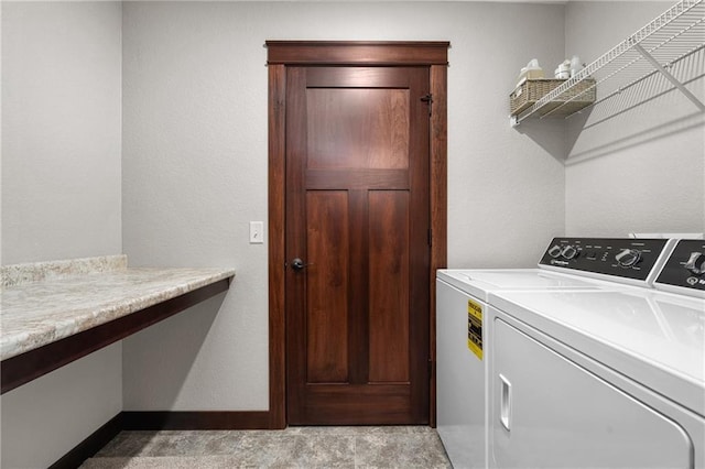 washroom featuring washing machine and dryer