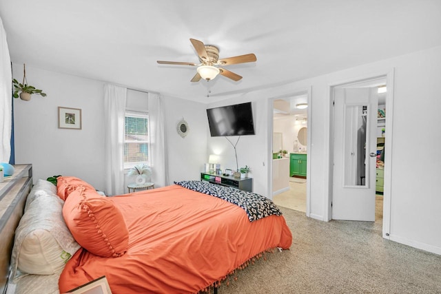 bedroom with ensuite bathroom and ceiling fan