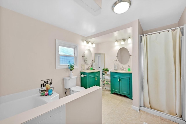 bathroom featuring vanity, curtained shower, and toilet