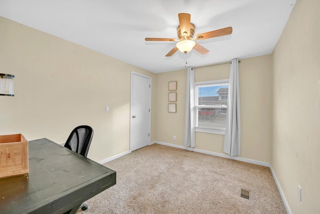 unfurnished office with light carpet and ceiling fan