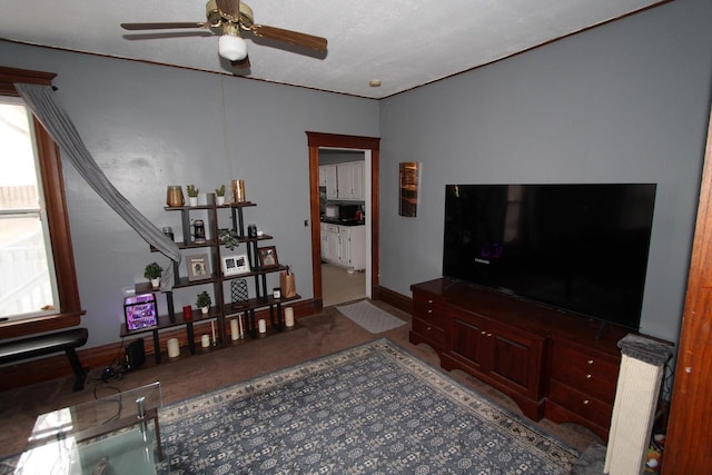 living room with ceiling fan