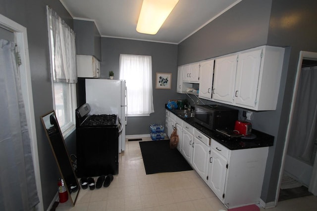 kitchen with crown molding, black appliances, and white cabinets