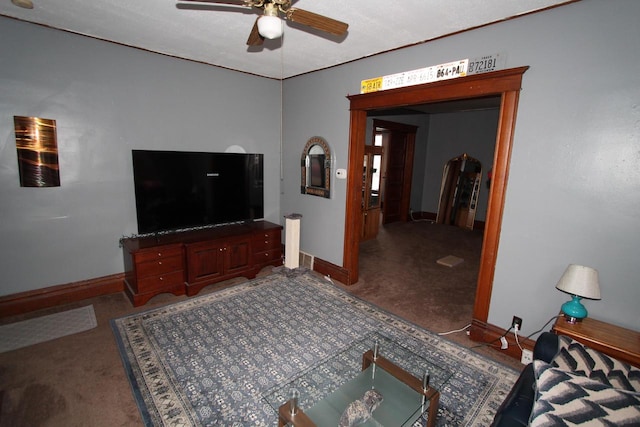 living room with ceiling fan and carpet flooring