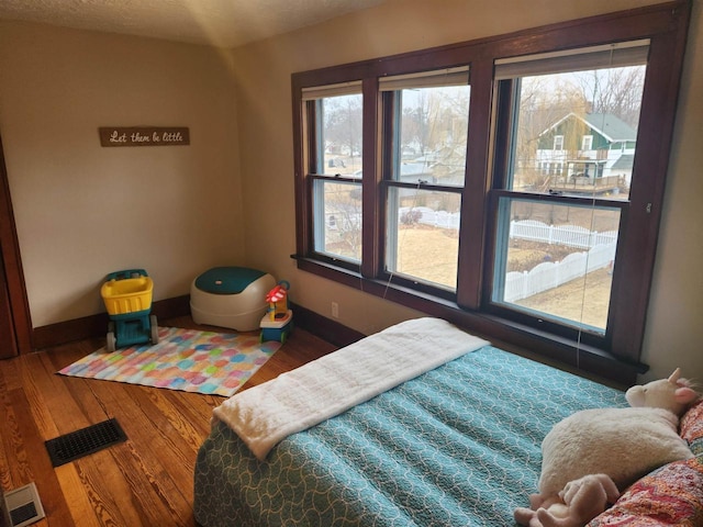 bedroom featuring hardwood / wood-style flooring