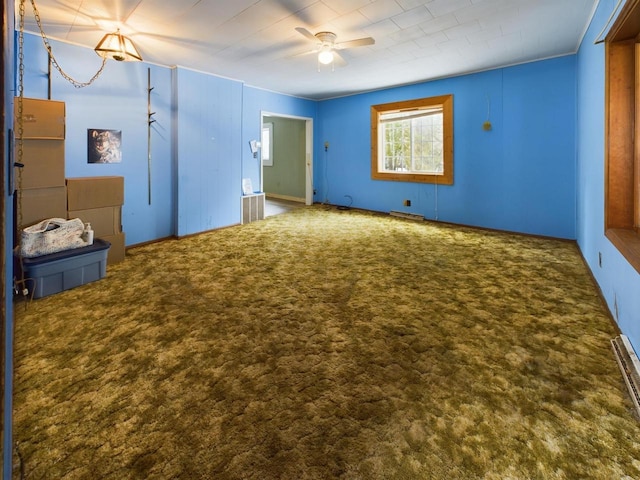 unfurnished bedroom with ceiling fan and carpet flooring